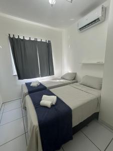 Ένα ή περισσότερα κρεβάτια σε δωμάτιο στο Apartamento de dois quartos, competo, em São Luis, Araçagy