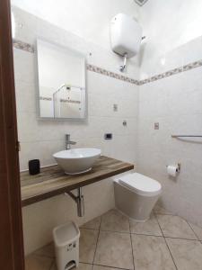 a bathroom with a sink and a toilet at Casa Leblanc in Civitavecchia +19 photos