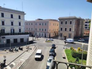 a city street with cars parked on the street at Casa Leblanc in Civitavecchia