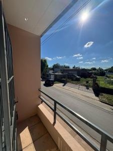 a balcony with a view of a street at Departamento Naon SP in San Pedro