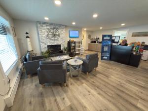 a waiting room with couches and a table in a store at West Beach Suites in Lincoln City