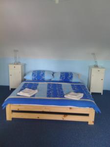 En eller flere senge i et værelse på Penzion Paták