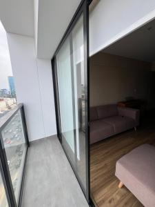 a living room with a couch in a building at Apartment in San Isidro in Lima