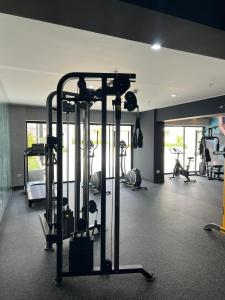 a gym with several tread machines in a room at Apartment in San Isidro in Lima