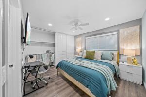 a bedroom with a bed and a desk at Entire Private 4BR-3Bth, King Bed, Gated Yard, Parking, Ranch, Available Now in San Diego