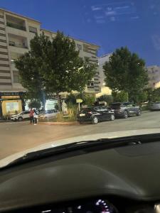 a view of a street with cars parked in a parking lot at Very nice modern air-conditioned apartment in Fez in Fès