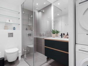 a bathroom with a shower and a toilet and a sink at 5 star holiday home in Aarhus C in Aarhus +7 photos