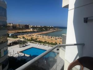 a view of a pool and a beach from a building at Scandic resort chalet sea view in Hurghada
