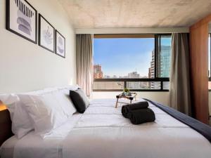 Ένα ή περισσότερα κρεβάτια σε δωμάτιο στο DM 1204 Tranquilidade e Conforto proximo à Unifesp, Hospitais e Metrô Vila Mariana +47 φωτογραφίες