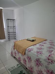 Postel nebo postele na pokoji v ubytování Quarto Confortável no Centro