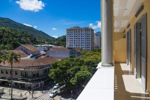 a view of the city from the balcony of a building at Grande Hotel Petrópolis in Petrópolis