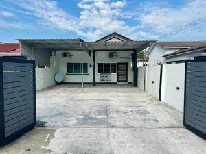 a house with two garage doors and a driveway at i Homes 19 at Ipoh Town 3R2B 9pax in Ipoh
