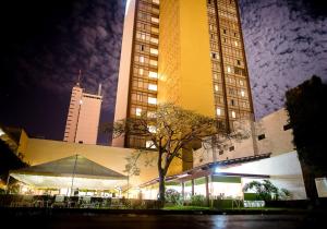 a building with a tent in front of it at night at HMB Guadalajara Centro in Guadalajara