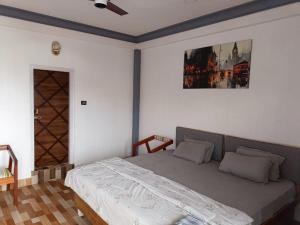 Postel nebo postele na pokoji v ubytování Nesting Abode Homestay