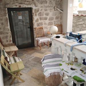 a room with a table and chairs and a door at Fischer Fritz 2 in Betina