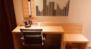a kitchen with a desk with a tea kettle on it at City Comfort Inn Zhuhai Jinwan Hangkong Xincheng in Zhuhai