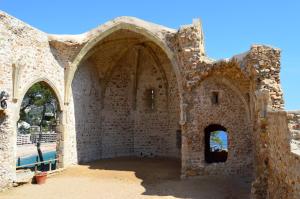 an old stone building with an archway at Apartments Soleil Tossa 5 in Tossa de Mar
