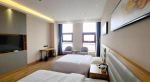 TV a/nebo společenská místnost v ubytování Green Tree Inn Express Tangshan Yueting County Bus Station