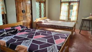 Ένα ή περισσότερα κρεβάτια σε δωμάτιο στο Delft Av home stay and food provider