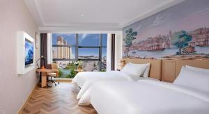Ένα ή περισσότερα κρεβάτια σε δωμάτιο στο Vienna Hotel Guiyang Yunyan District Government