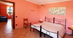 Postel nebo postele na pokoji v ubytování Agriturismo Al Brich