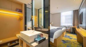 a hotel room with a bed and a sink at Echarm Hotel Guanzhou Tianhe Grandview Mall in Guangzhou