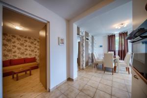 a living room with a couch and a table at Apartments Perla in Rukavac