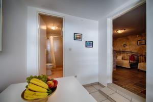a bowl of fruit on a table in a room at Apartments Perla in Rukavac +53 photos