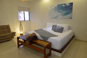 Cama ou camas em um quarto em Oasis Tajaja Pousada