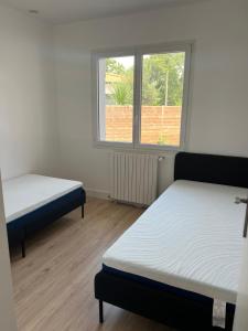 Ένα ή περισσότερα κρεβάτια σε δωμάτιο στο Villa Mauret Plage +9 φωτογραφίες