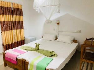 Sigiri Lodge Tree House客房内的一张或多张床位