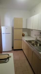 Kuchyň nebo kuchyňský kout v ubytování Apartments Luka + 4 fotografie