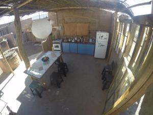 an overhead view of a kitchen with a table and chairs at Casa Buenavista in San Pedro de Atacama