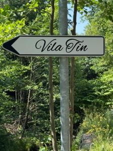 a white sign with the word villa tim on it at Villa Tin & Koča Tin - Nature, Water and Peace in Prestranek +97 photos