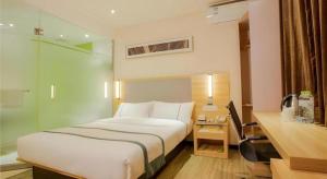 Postel nebo postele na pokoji v ubytování City Comfort Inn Nanning Guangxi University