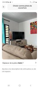 a page of a bedroom with a bed and a tv at Fare Kahaia Rangiroa in Avatoru