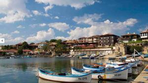 a group of boats are docked in a harbor at Windmill Nessebar studio with sea view in Nesebar