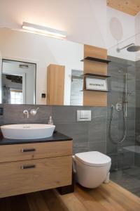 a bathroom with a sink and a toilet at Alpine chic apartment at Rothorn cable car in Lenzerheide