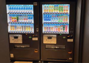 a vending machine filled with lots of bottles of soda at Henn na Hotel Premier Nara in Nara