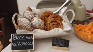 a basket of pastries sitting on top of a table at Stella Alpina in Paularo