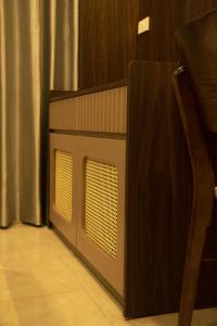 a set of speakers on the side of a room at Street-facing room 2BR Balcony Elegance Home in Hanoi