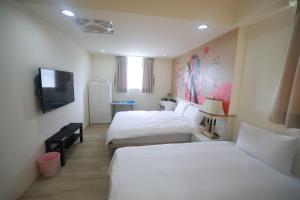 A bed or beds in a room at Sea Keelung