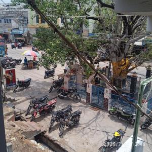 a group of motorcycles parked on a city street at Sai Home Stay in Narasaraopet