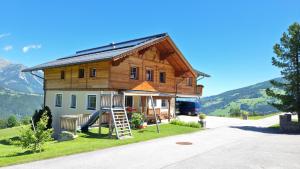 a house with a solar roof on top of it at Haus Tauernseitn in Schladming