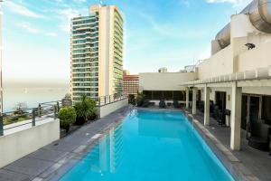 a large swimming pool on the roof of a building at Armada Hotel Manila in Manila