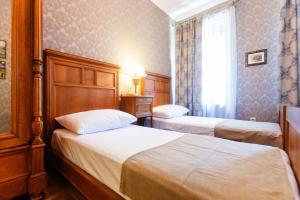 Voodi või voodid majutusasutuse Bloom Boutique Hotel toas