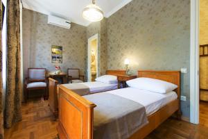 Postel nebo postele na pokoji v ubytování Bloom Boutique Hotel