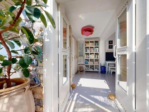 a hallway of a house with a potted plant at Speires suites in Irakleia