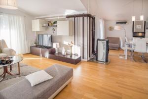 a living room with a couch and a table at Apartment Ivana 2435 in Malinska