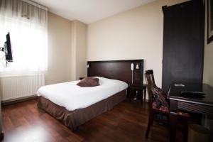 Postel nebo postele na pokoji v ubytování Ambiance Hotel